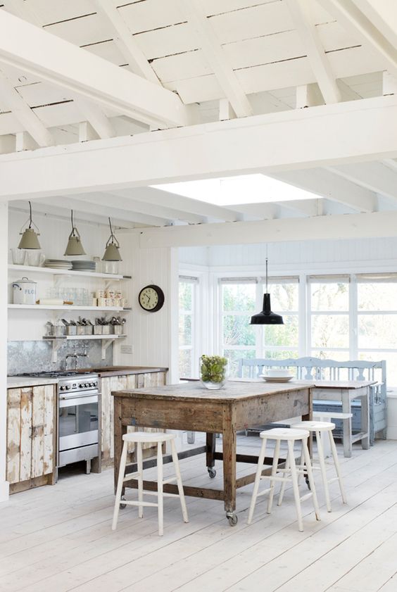 White open beam vaulted ceiling. Farmhouse kitchen.