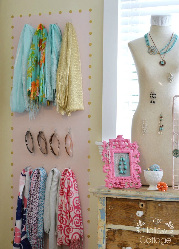 Organized Accessory Storage - scarves practically double as wall art