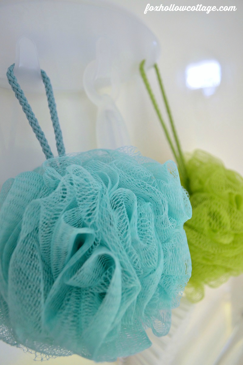 Bath poofs and back scrubbers are organized with the multi-hook, plus they can dry between uses |  Command Brand Bathroom Organizing #DamageFreeDIY #ad