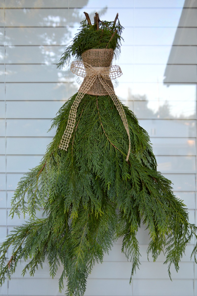 13. Cedar boughs, burlap and ribbon make for inexpensive, weather resistant holiday decor.