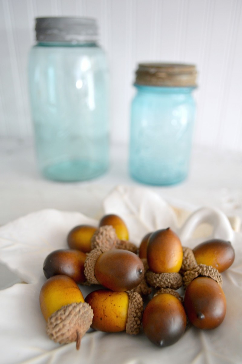 How To Make a Fabric Covered Decorating Backdrop | Fall decorating at foxhollowcottage.com with Vintage aqua Ball mason jars & acorns.