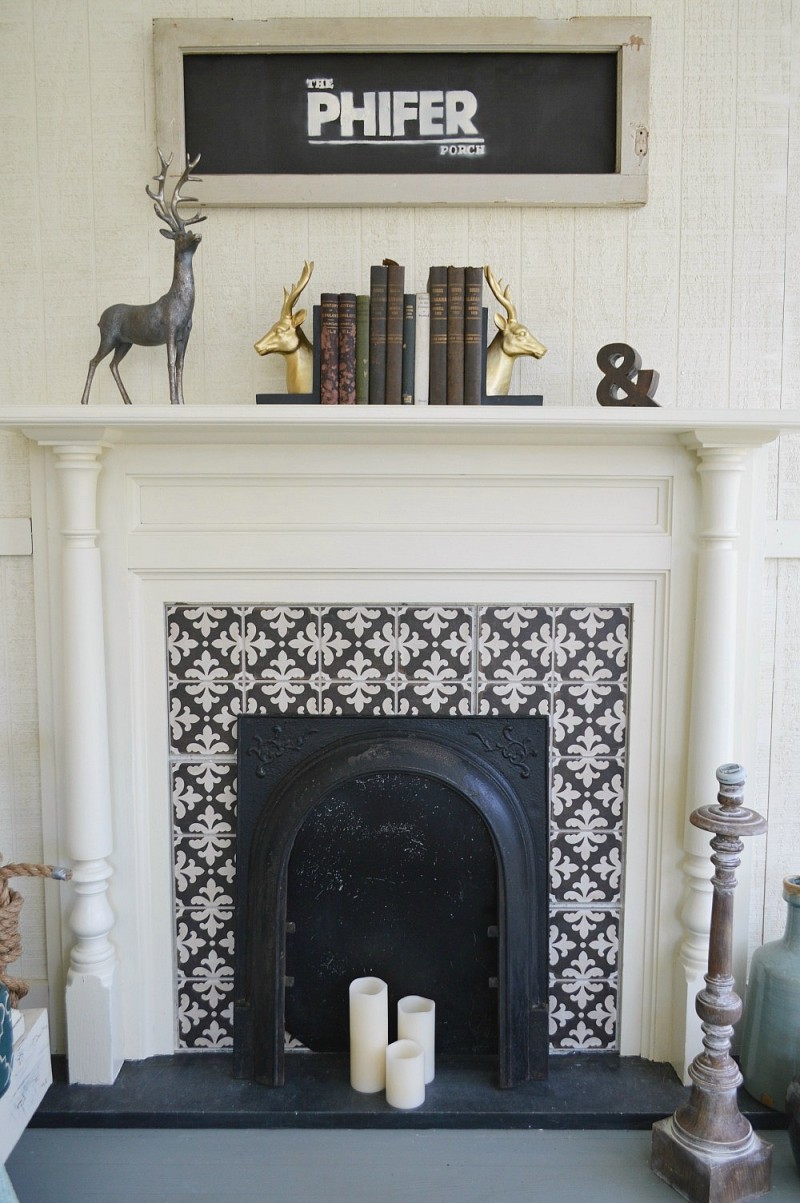 Original fireplace in a Southern fixer upper, repurposed as a decorative accent on the covered porch. Cement Tile Surround
