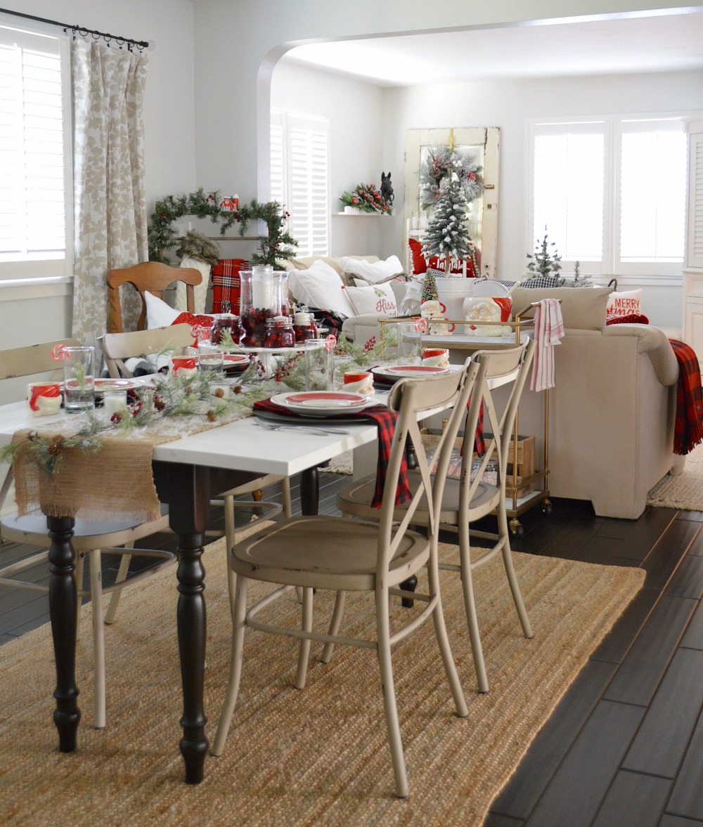 Have Yourself A Merry Little Christmas. Fox Hollow Cottage Holiday.  Vintage drop leaf dining table & farmhouse metal chairs. Centerpiece of fresh cranberries, mason jars and hurricane/candle on vintage milk glass.  