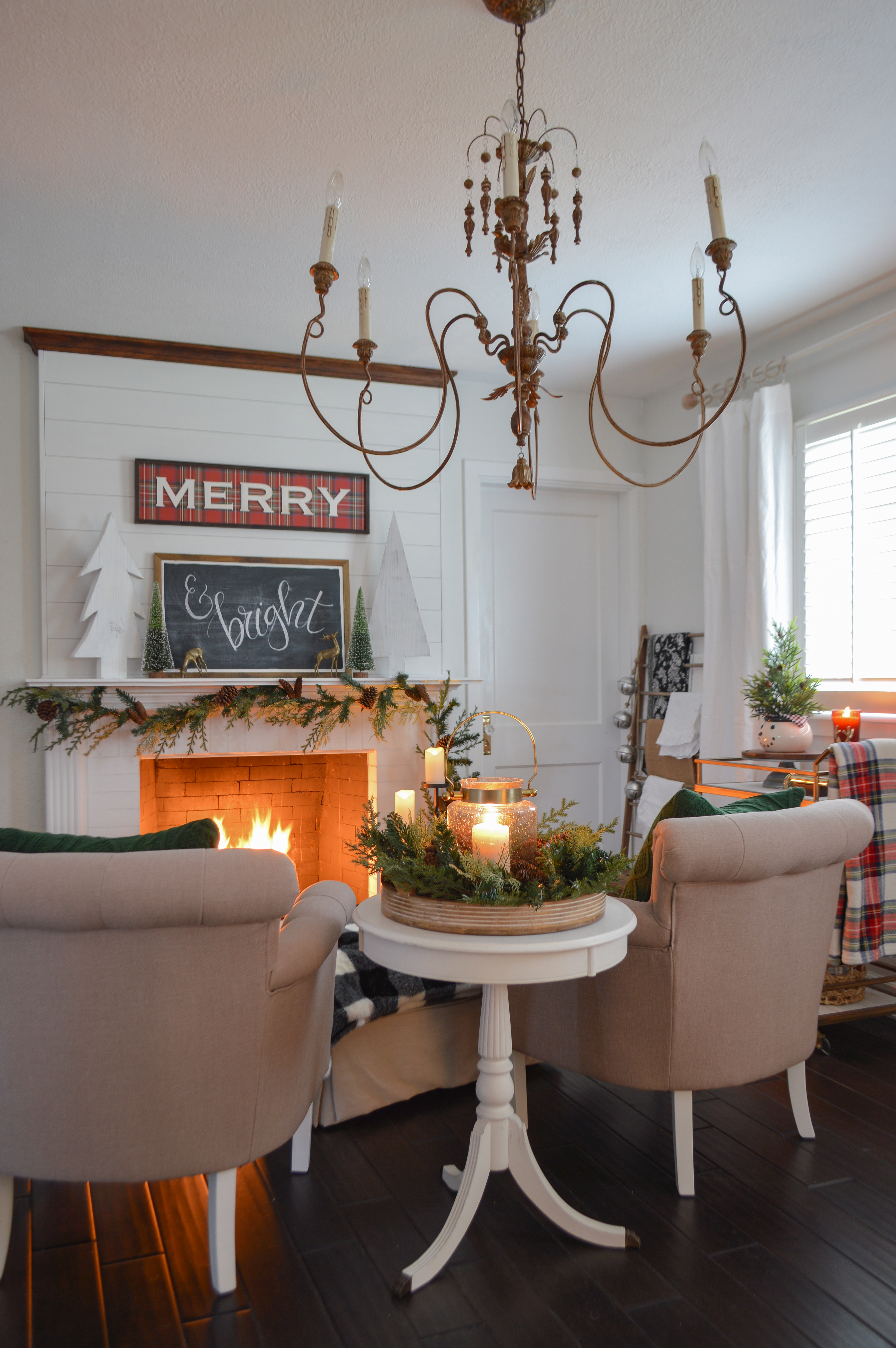 Holiday Housewalk Merry Christmas Home Tour - Cozy seating area, white shiplap fireplace, MERRY plaid and chalkboard signs, french country chandelier. #holidayhousewalk #christmashometour #cozychristmas #cottagechristmas #farmhousechristmas