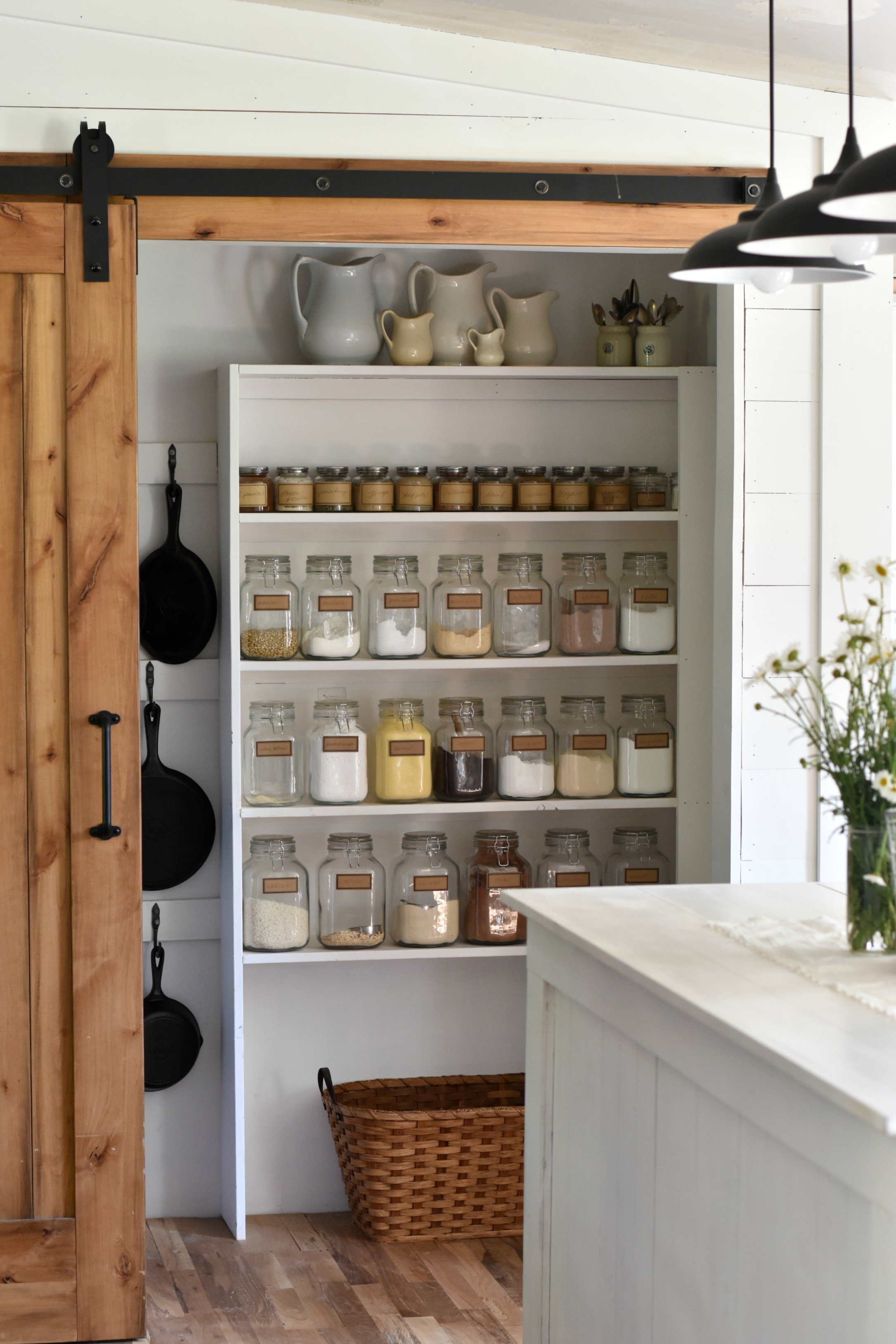 https://foxhollowcottage.com/wp-content/uploads/2020/03/20-Real-Life-DIY-Pantry-Makeovers-With-Tips-And-Ideas-at-Fox-Hollow-Cottage-blog-Walk-In-Kitchen-Storage-wit-Natural-Wood-Barn-Door.jpg