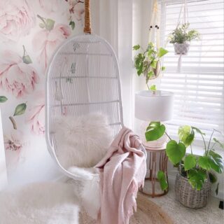 Pink floral wallpaper white swing chair bedroom